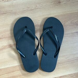 Black flip flops